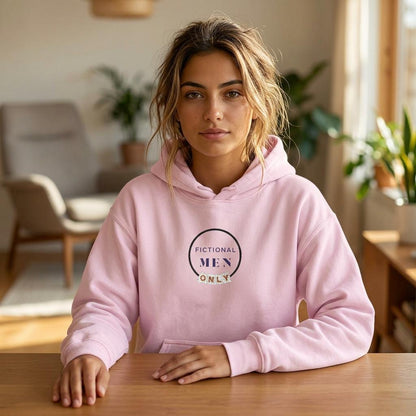 Woman wearing embroidered "Fictional Men Only" light pink sweatshirt with cozy bookish aesthetic.