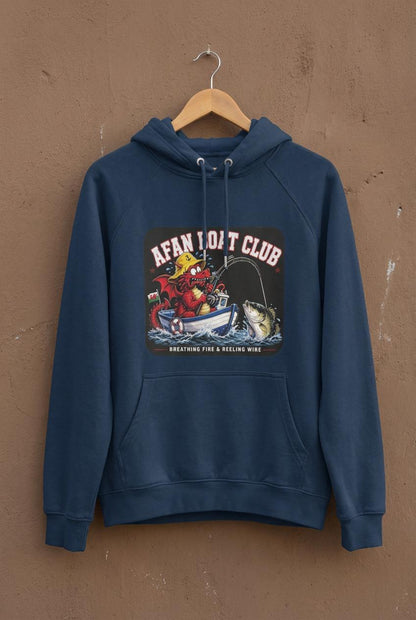 Navy blue Afan Boat Club Welsh Dragon hoodie on a hanger, red dragon breathing fire and reeling wire print, weathered concrete backdrop.
