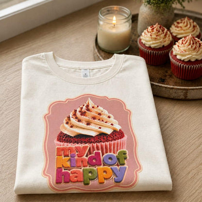 Ecru cupcake T shirt with My Kind of Happy graphic styled beside cupcakes and a lit candle.