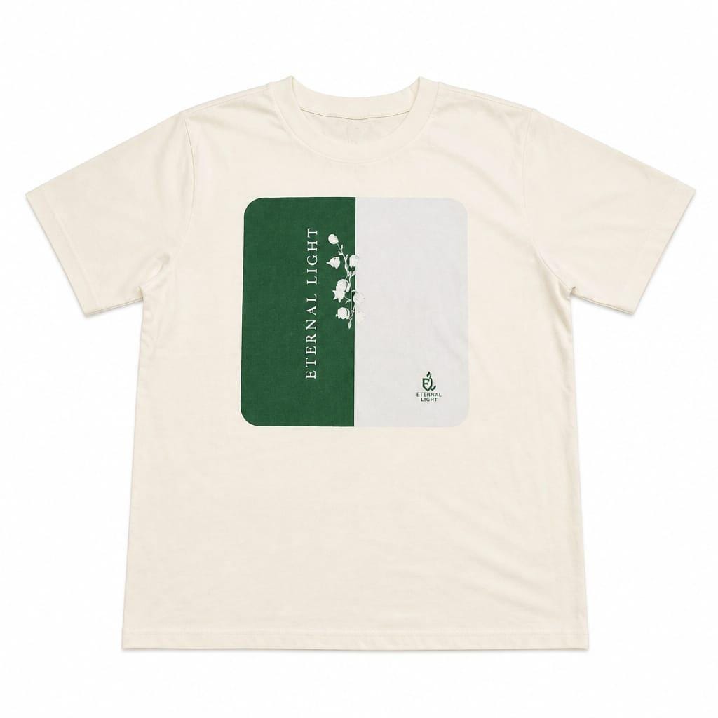 The premium ecru cream graphic t-shirt laid out flat on neutral background.